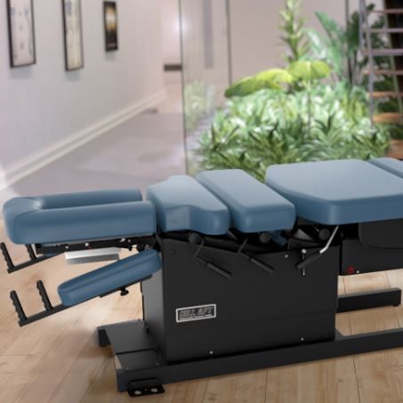 Hill Flexion Distraction chiropractic table, shown in blue with black base.  This is the model in treatment room 1. 