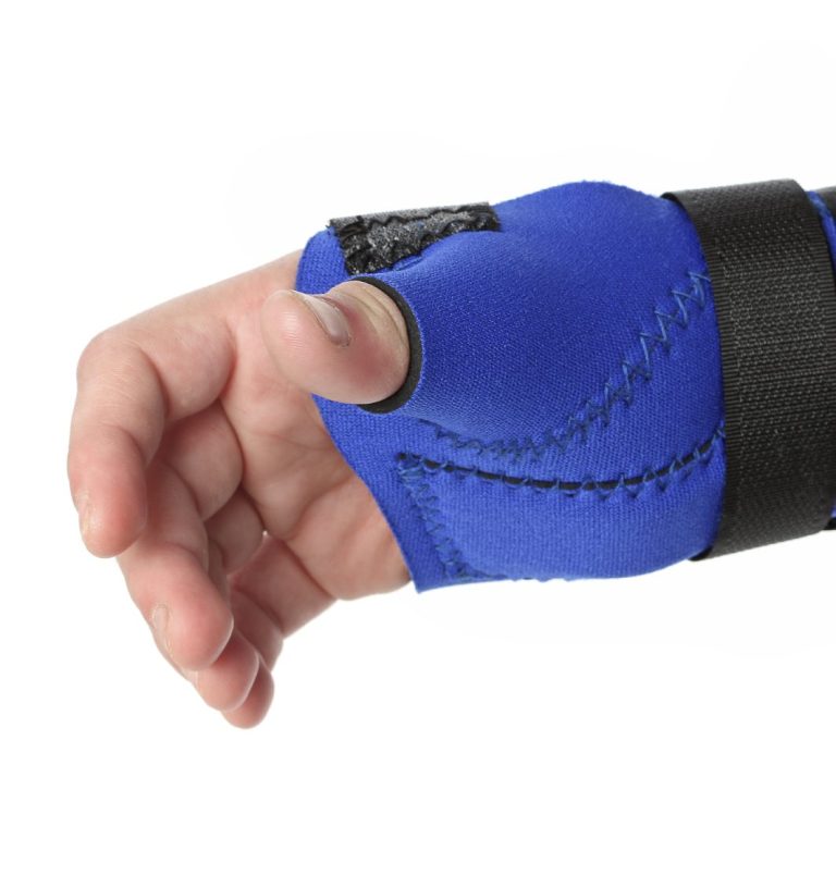 Blue wrist brace on human right arm/hand.